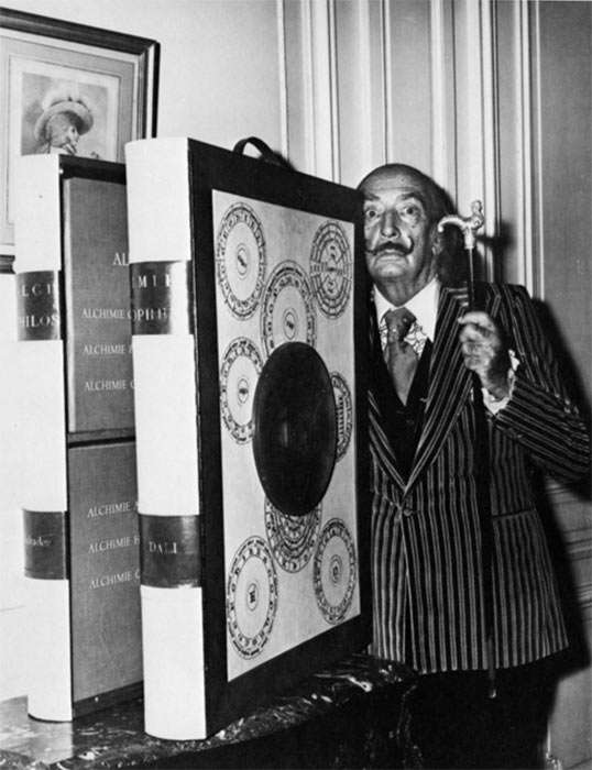 Dali with a copy of The Alchemy of Philosphers