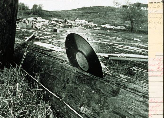 record embedded in wooden pole